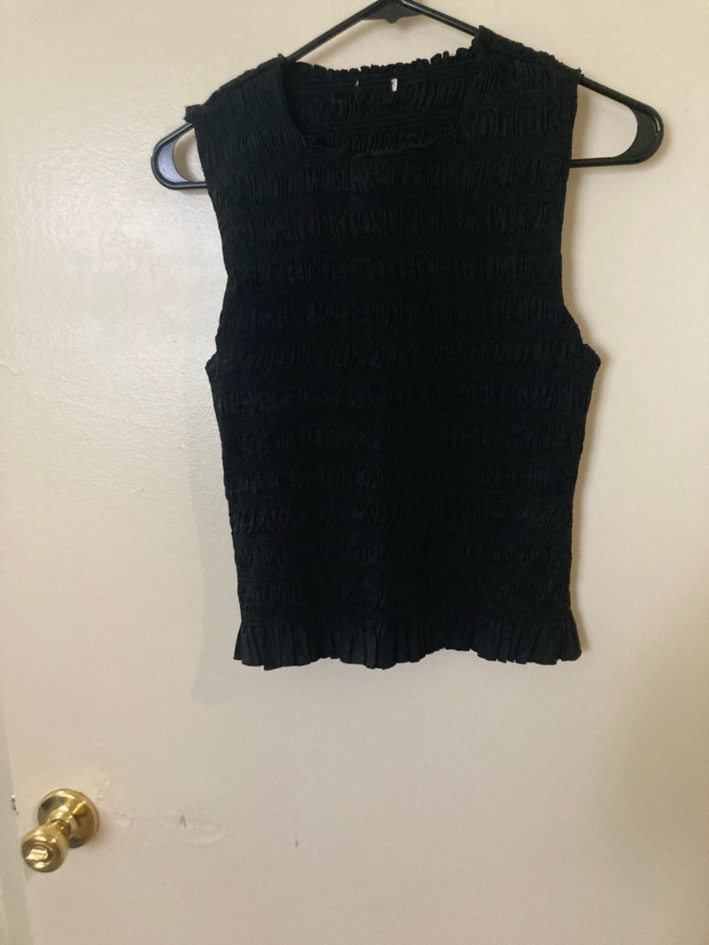 Sleek Black Smocked Sleeveless Tank with Ruffle Hem